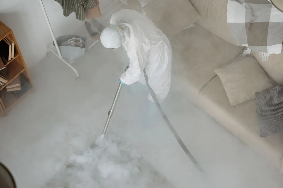 Biohazard cleanup technician in protective equipment, Paschall, Philadelphia, PA